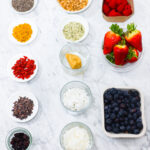 In this photo, you can see an açai bowl ingredients and toppings