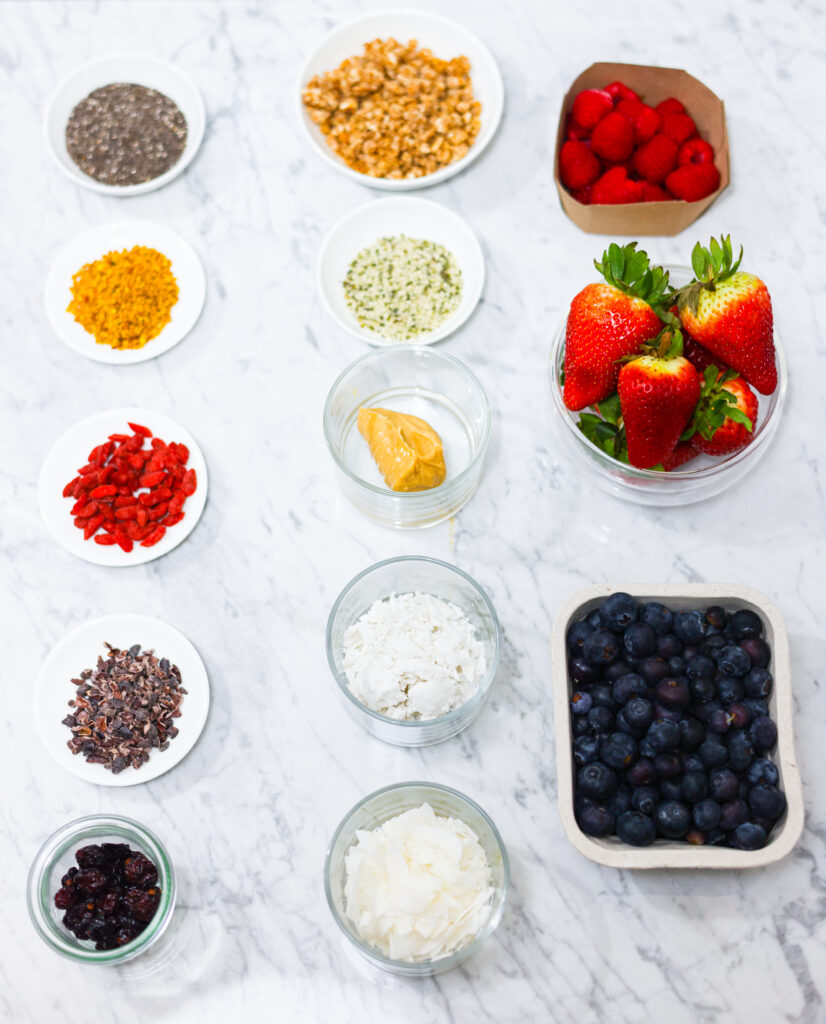 In this photo, you can see an açai bowl ingredients and toppings