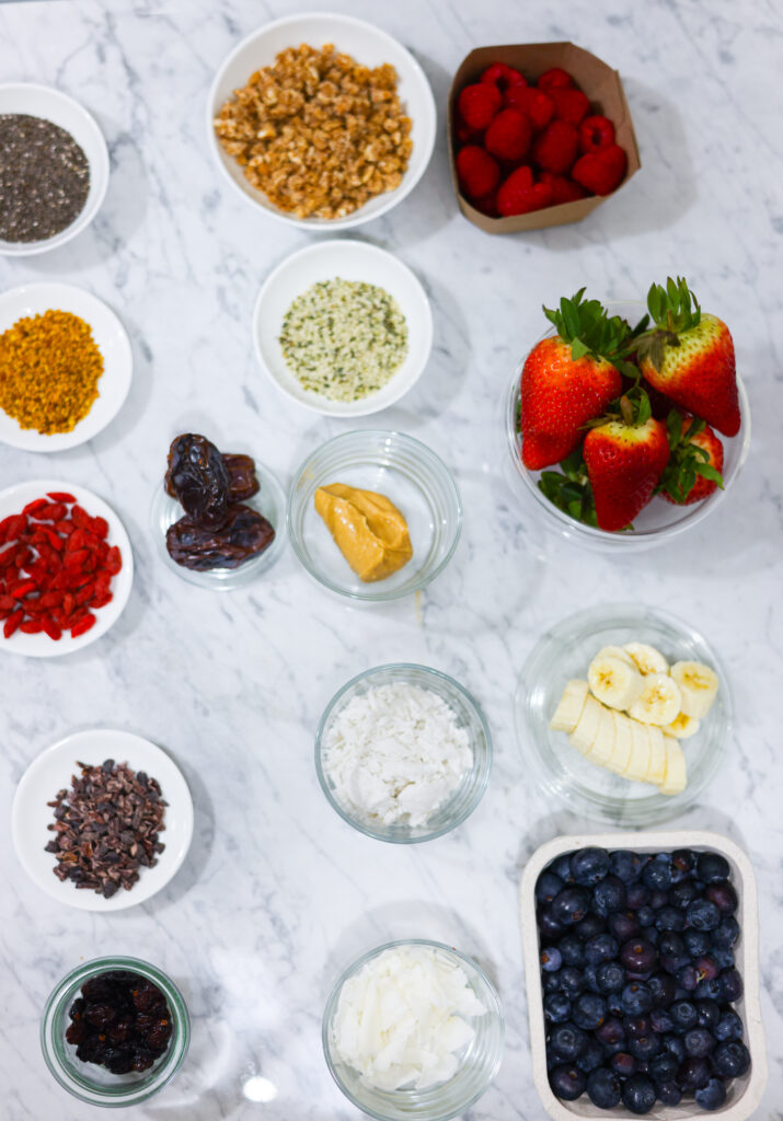 In this photo, you can see an açai bowl ingredients and toppings