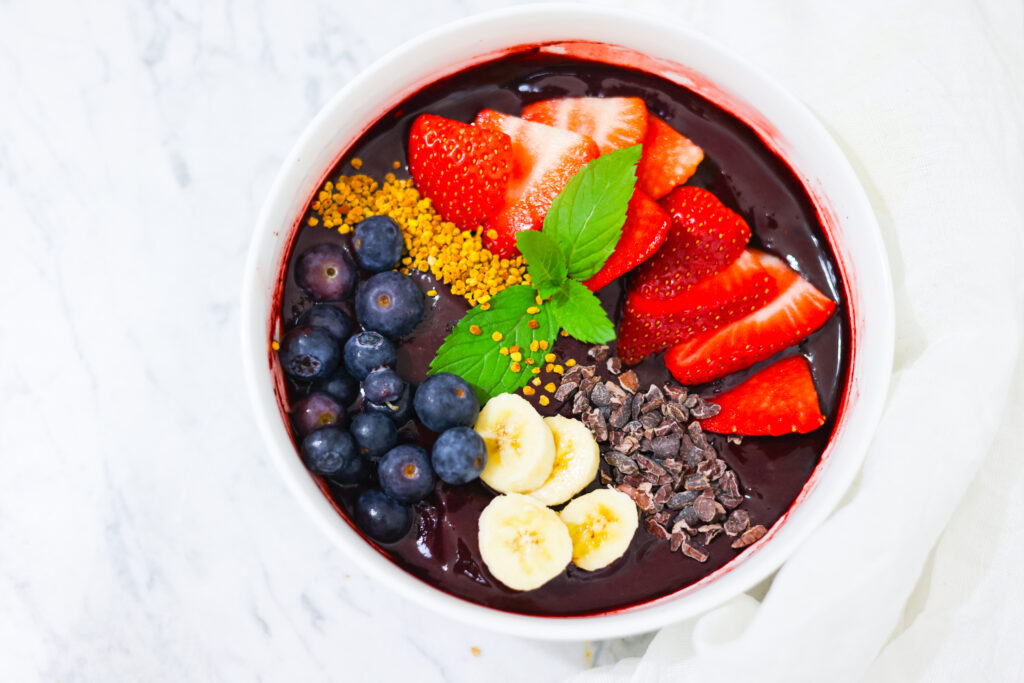 In this photo, you can see an açai bowl garnished