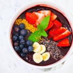 In this photo, you can see an açai bowl garnished