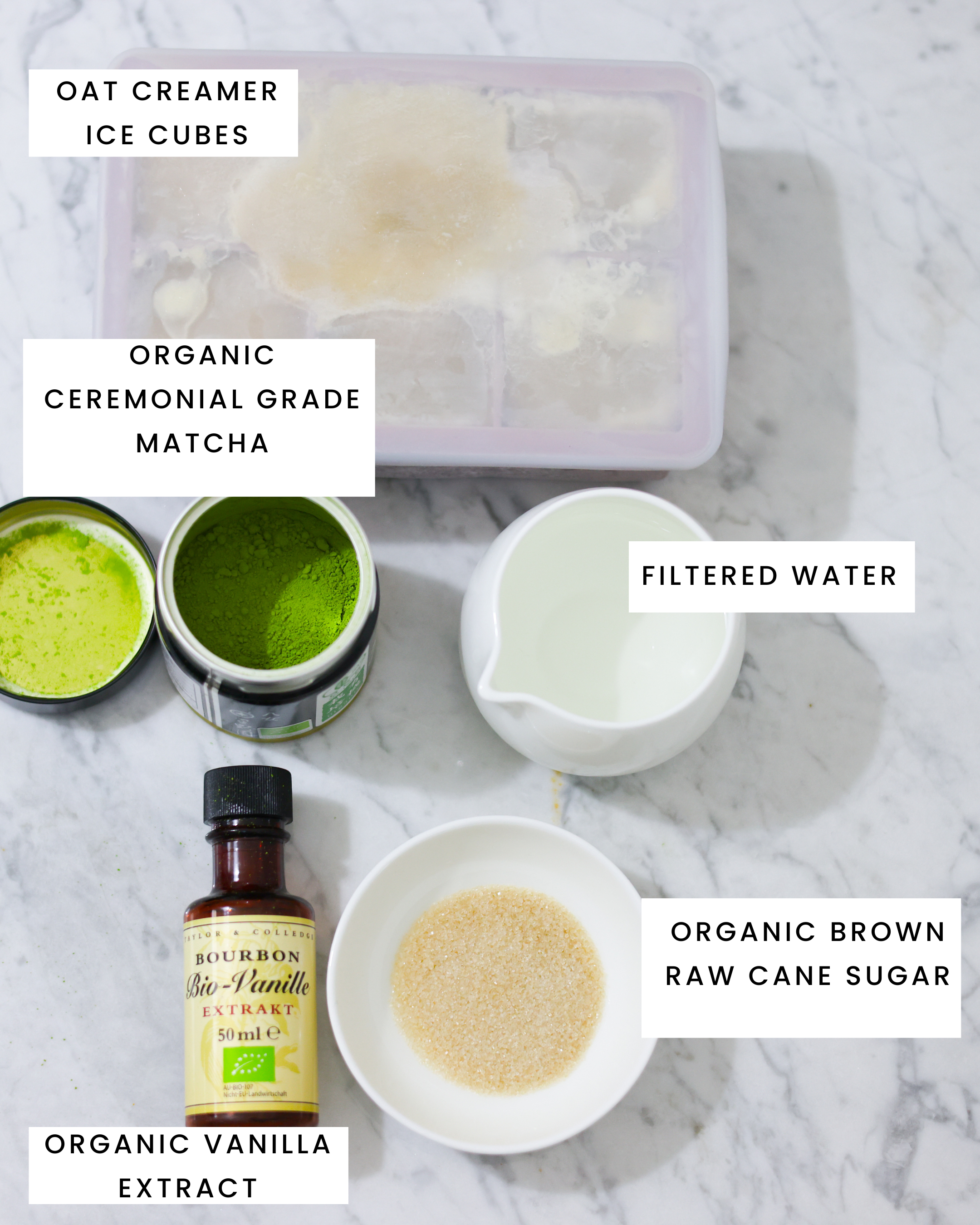 In the picture you can see all the ingredients listed on the Carrara marble.
The following ingredients can be recognized:  Oat creamer ice cubes, organic ceremonial grade matcha, filtered water, organic vanilla extract and organic brown raw sugar cane