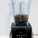 In this picture you can see coffee beans in a Vitamix blender