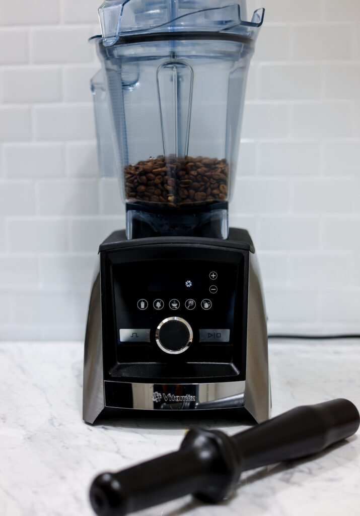 In this picture you can see coffee beans in a Vitamix blender