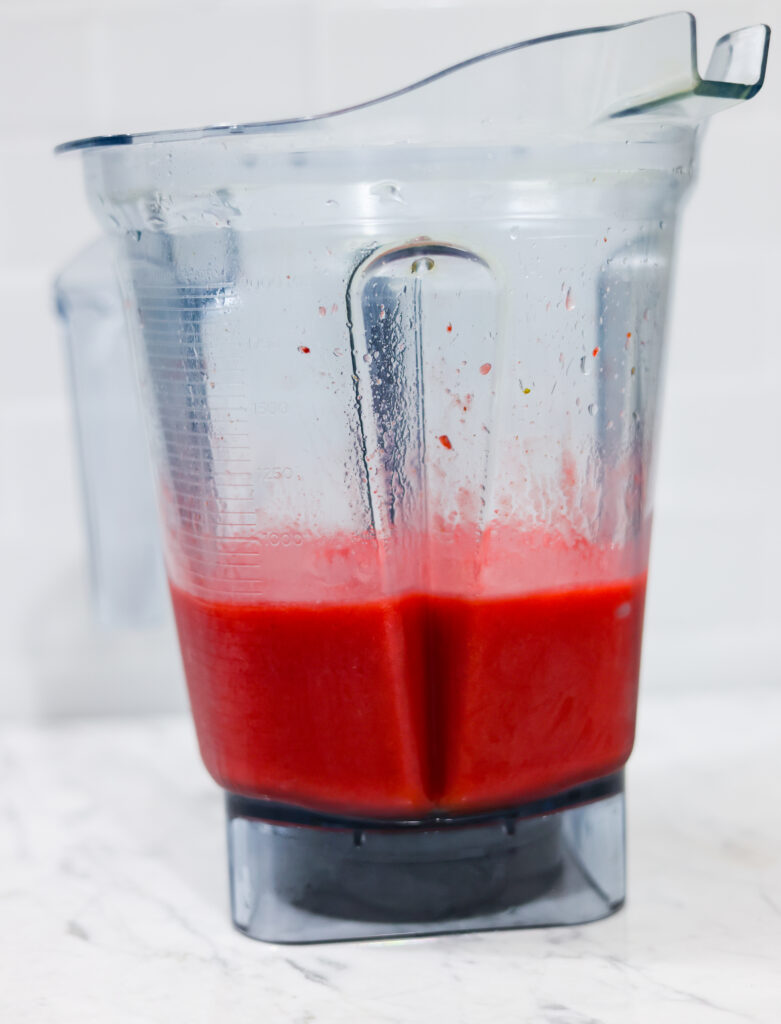 In this picture you can see The Vitamix container contains organic strawberries, which are puréed