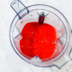 In this picture you can see The Vitamix container contains organic strawberries, which are puréed