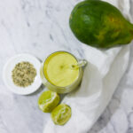 In this picture you can see the mango avocado smoothie. As decoration you can see an organic lime in front of the crystal glass.