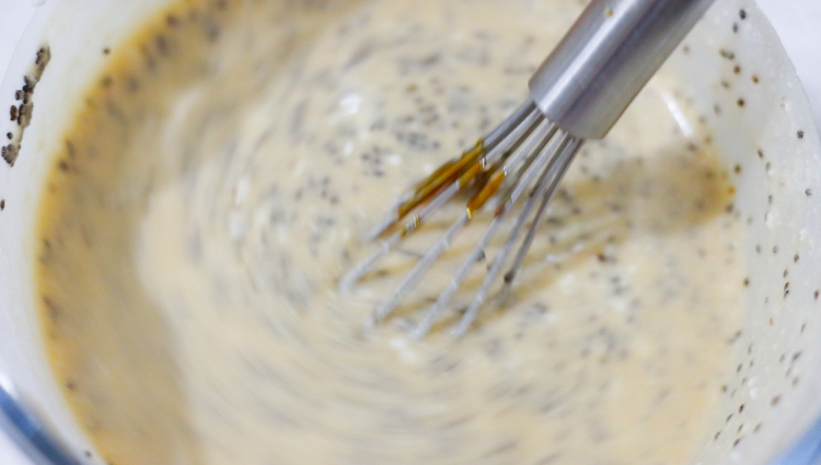 In this picture you can see a Pyrex glass filled with coconut milk and all the ingredients for Strawberry Chia Pudding