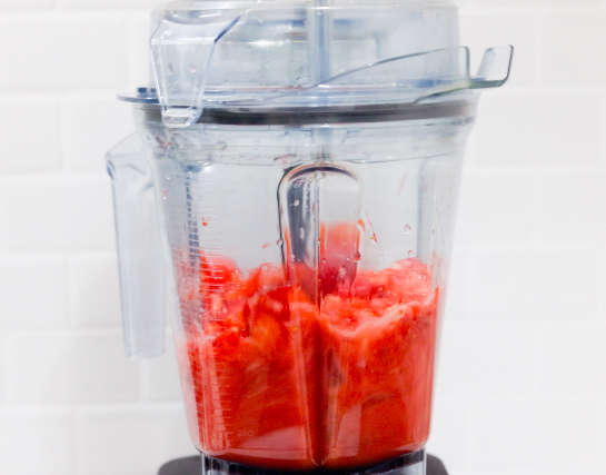 In this picture you can see The Vitamix container contains organic strawberries, which are puréed