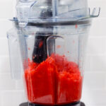 In this picture you can see The Vitamix container contains organic strawberries, which are puréed