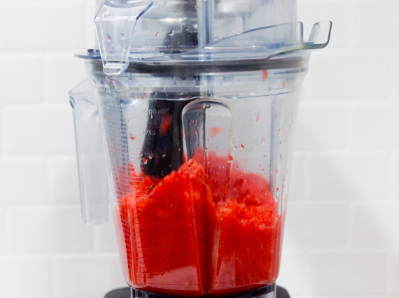 In this picture you can see The Vitamix container contains organic strawberries, which are puréed