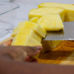 In this picture you can see a flight pineapple being cut into spears